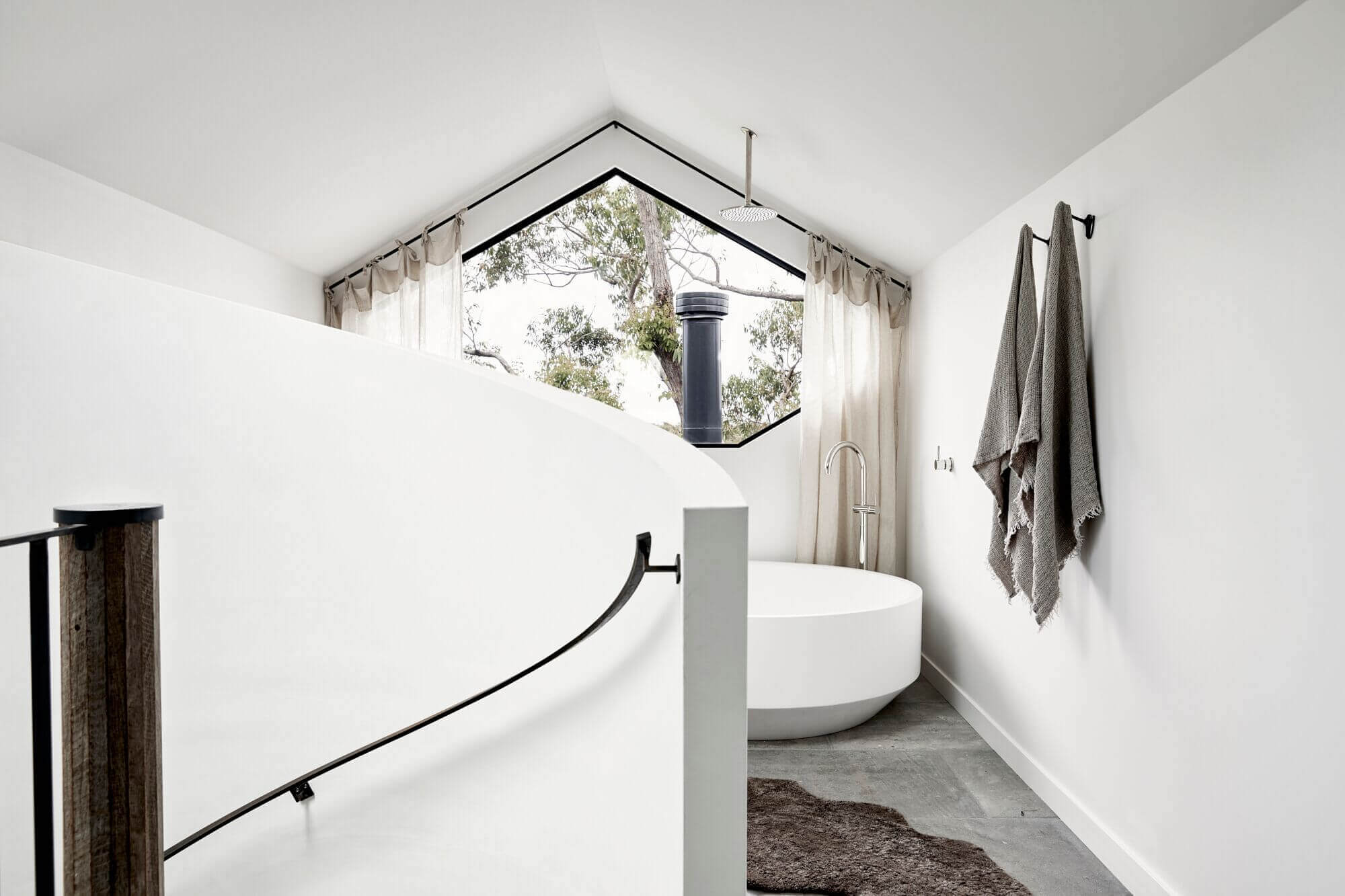 Open plan ensuite at The Cabin, Byron Beach Abodes with round stone bath