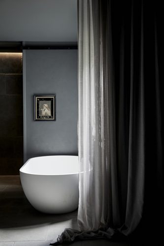 Stone bath in the open ensuite in the Deluxe King Room at The Bower, Byron Bay Boutique Hotel