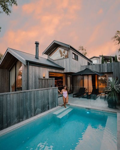 Cabin exterior and pool at sunset, Byron Beach Abodes