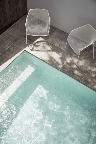 Eco Outdoor chairs beside pool at The Lodge, Byron Beach Abodes