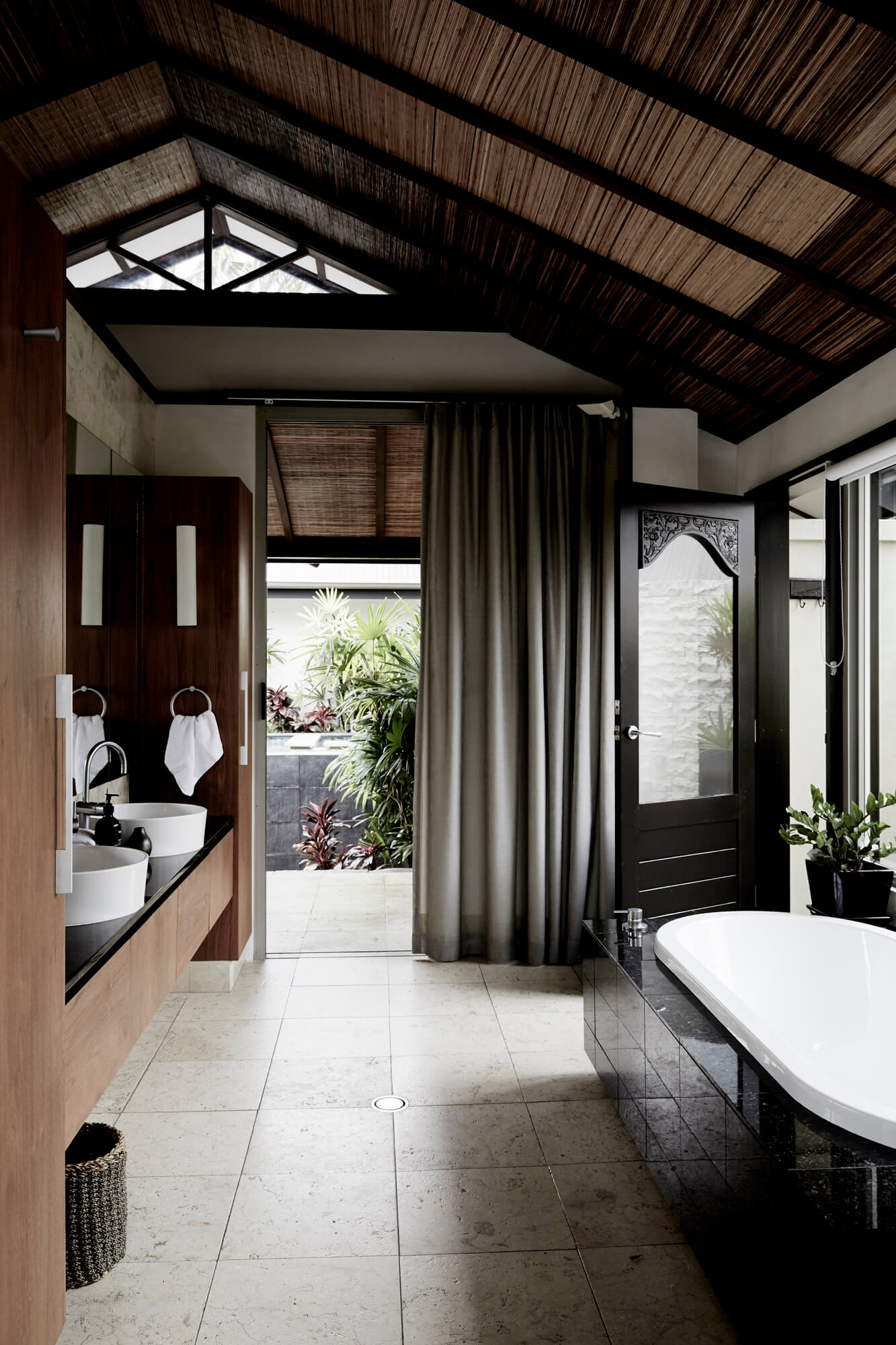 Grand master ensuite at The Villas of Byron with bathtub, heated marble floors, double vanity and views to lush gardens outside
