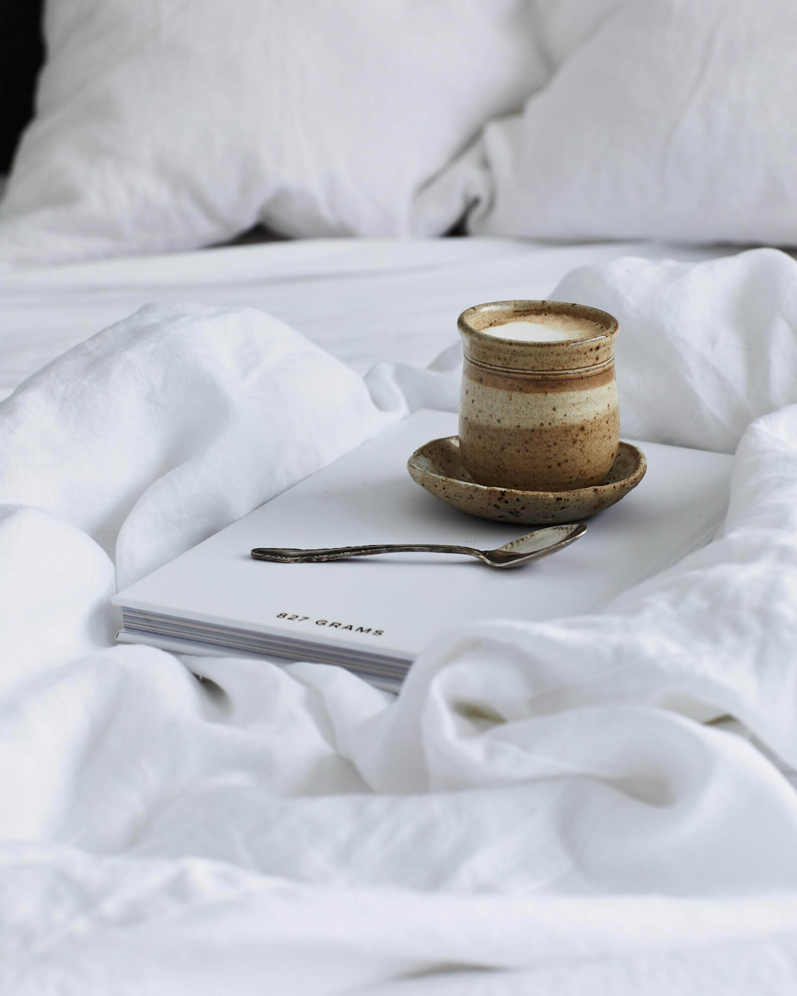 Coffee in bed with hand-made ceramic cup