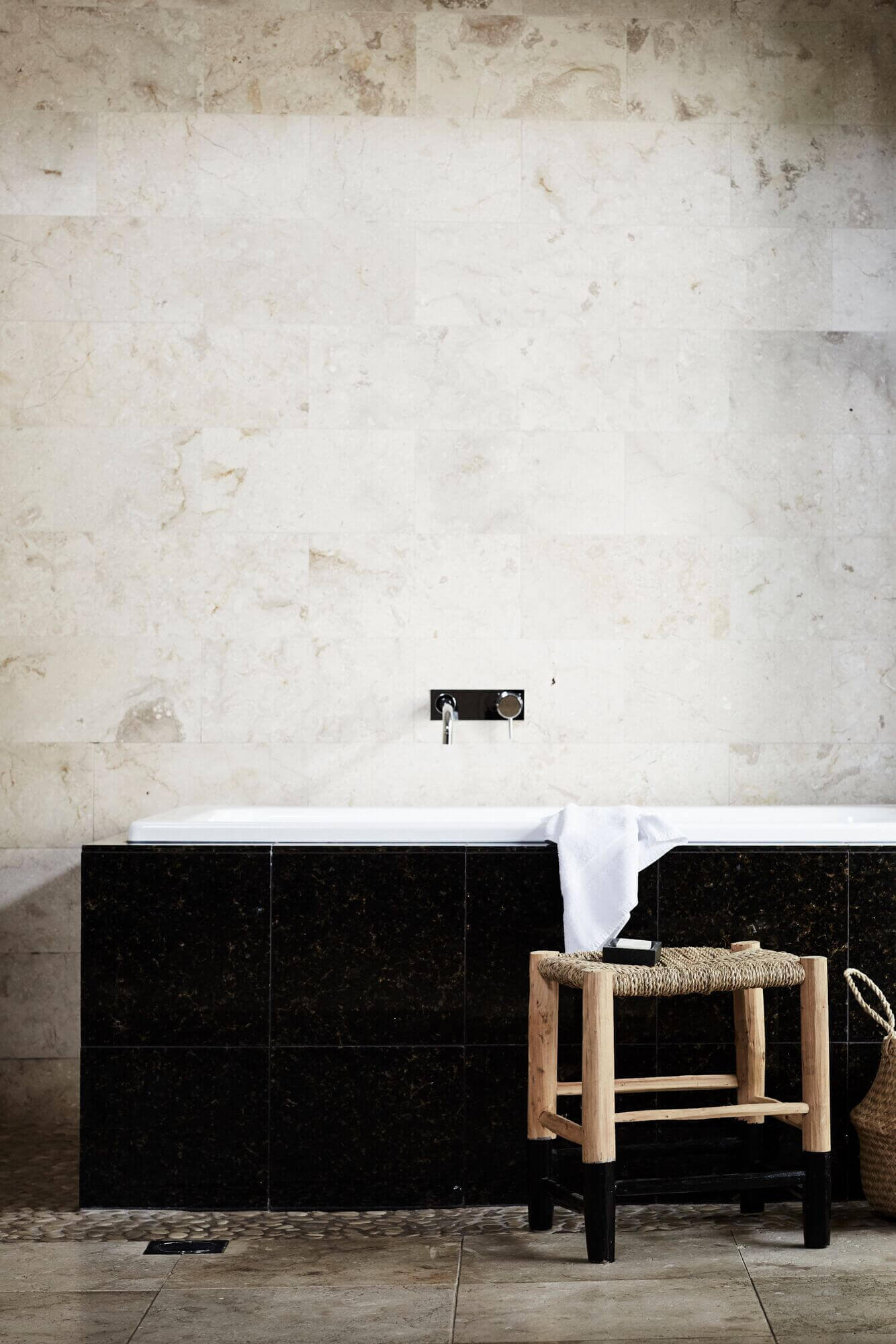Japanese soaking tub with marble tiled walls at The Villas of Byron