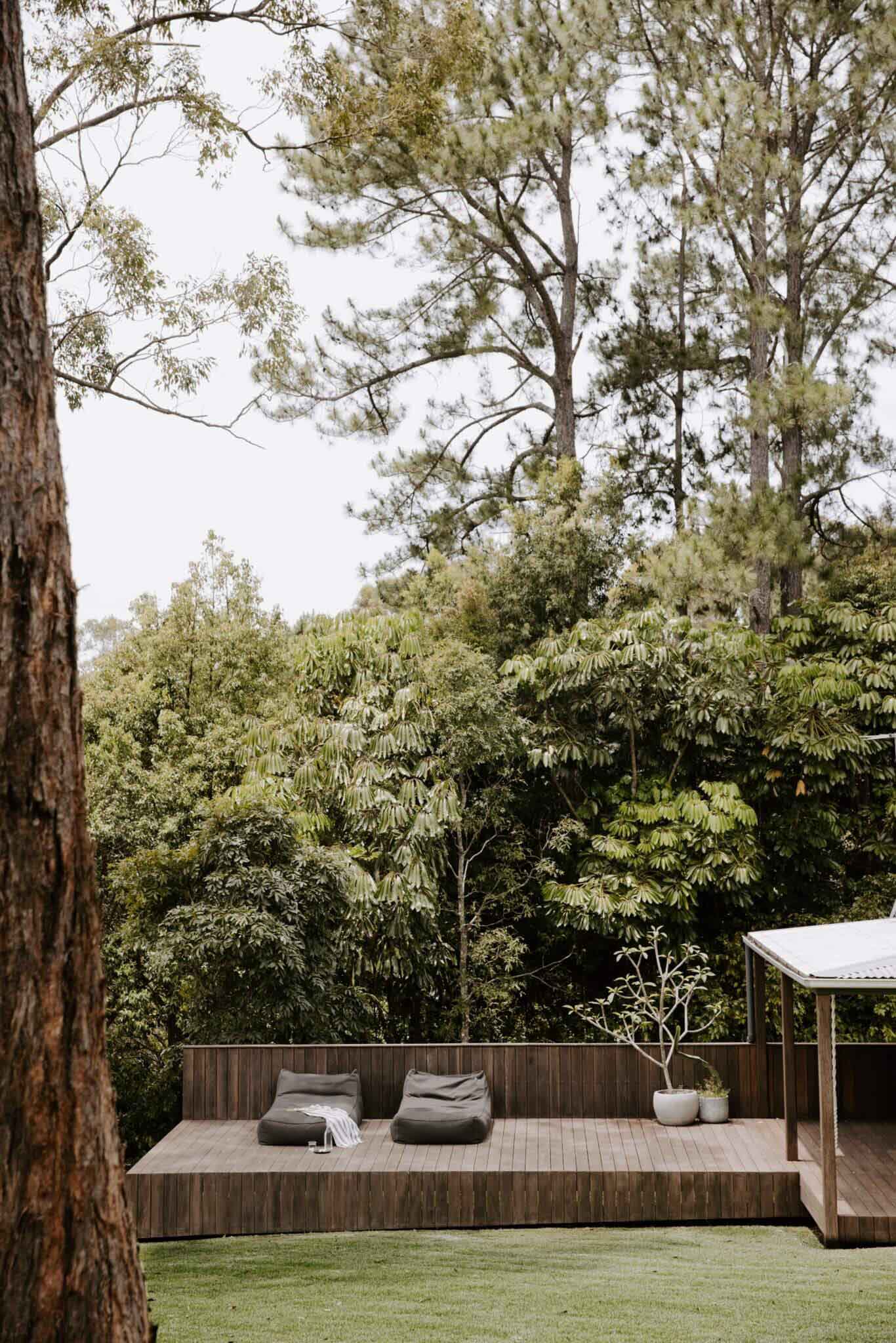 Beanbags on the deck overlooking the lush Byron Hinterland at The Perch accommodation, Byron Beach Abodes