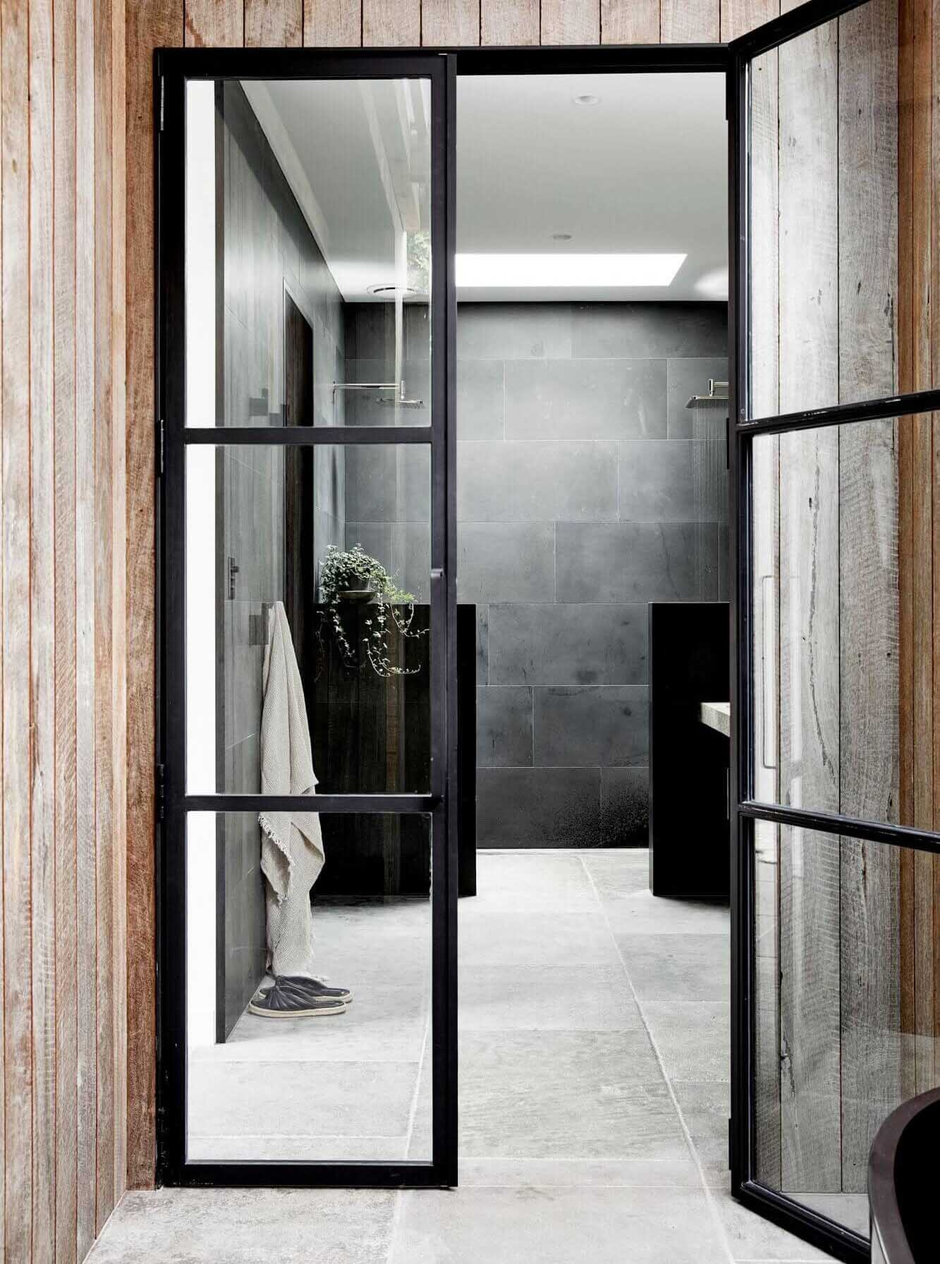 Custom steel framed doors leading into the ensuite at The Cabin, Byron Beach Abodes