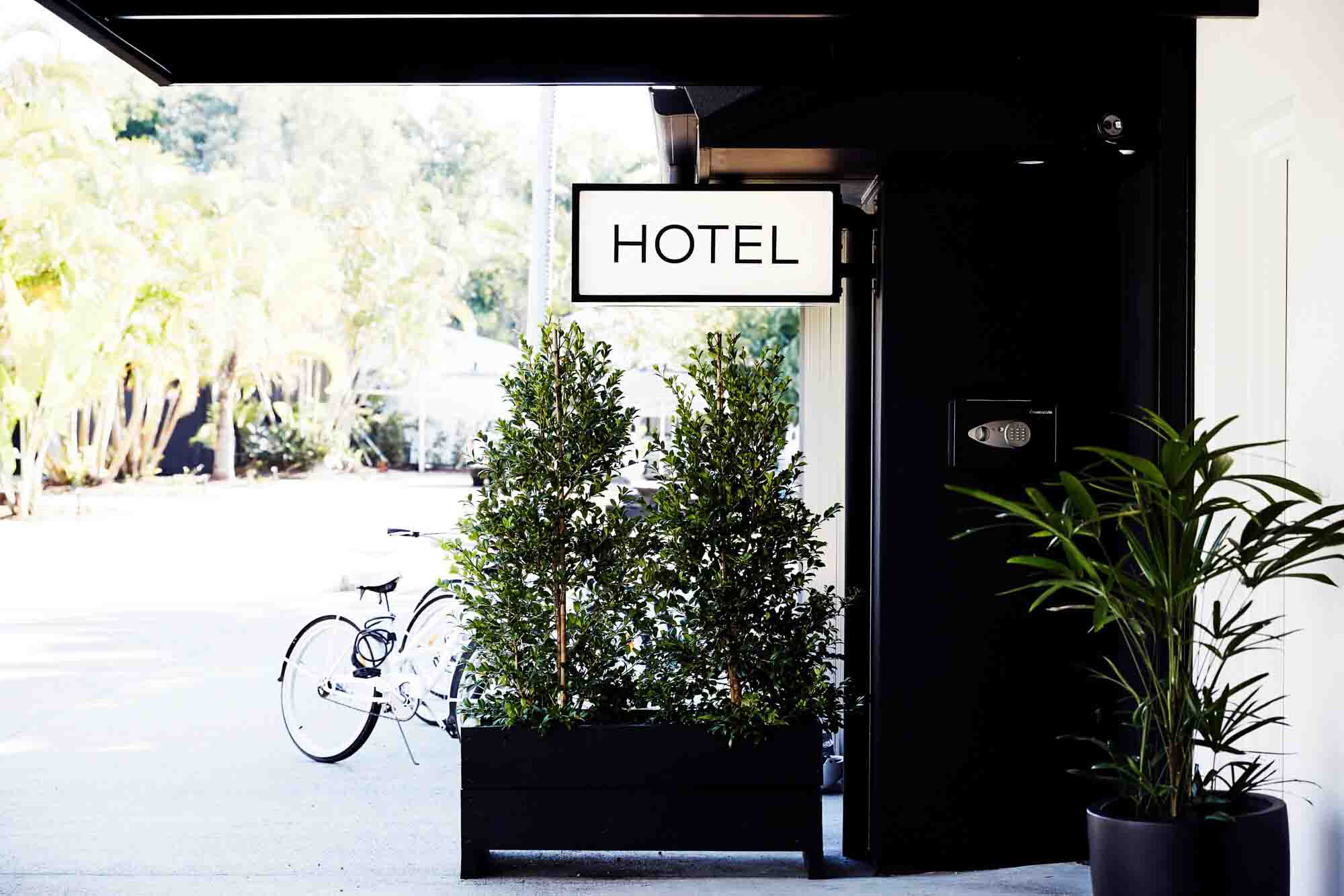 Hotel sign at entrance to The Bower Byron Bay hotel reception