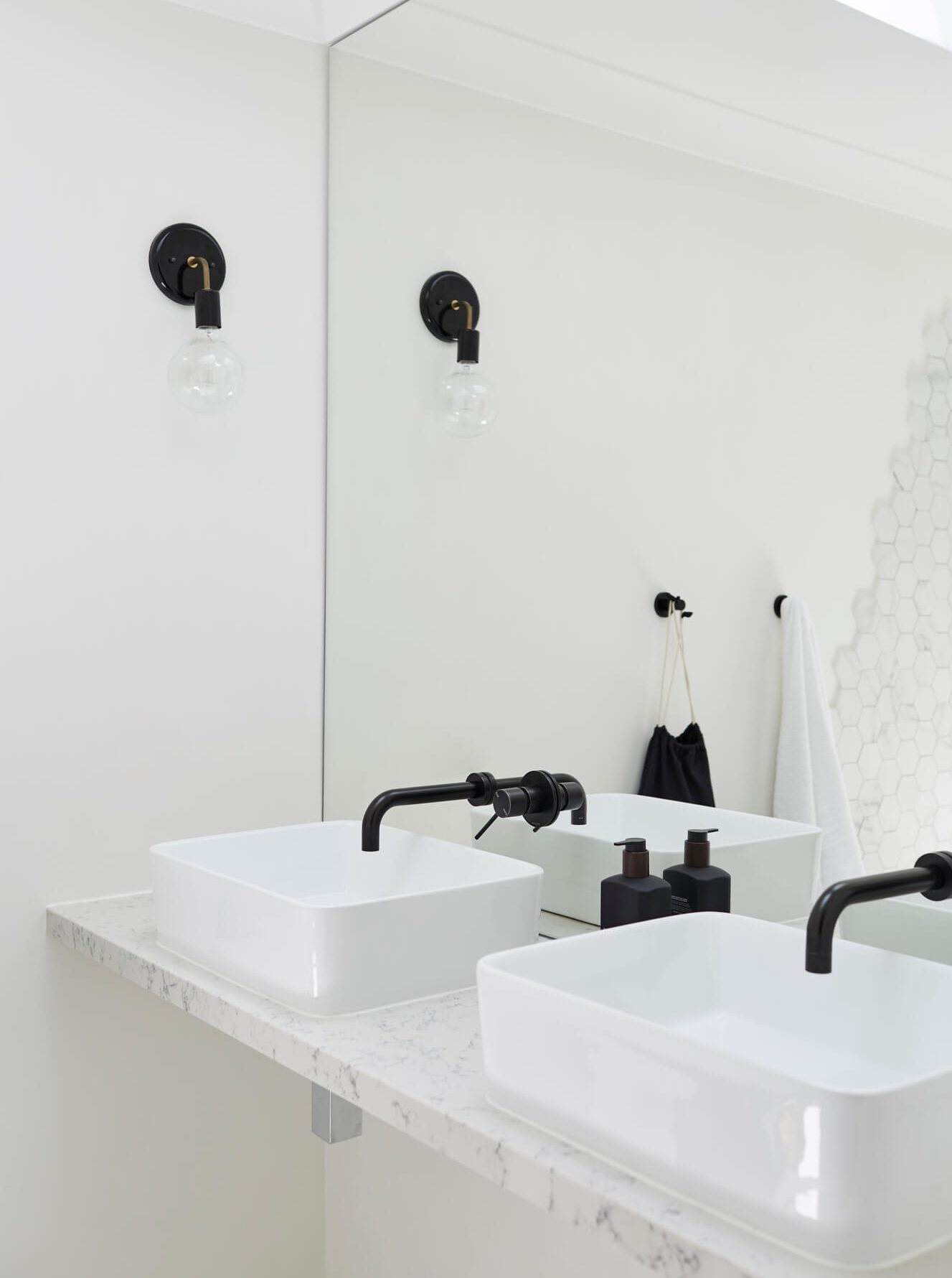 Double vanity at Bower House, The Bower Byron Bay with black feature tapware and wall light